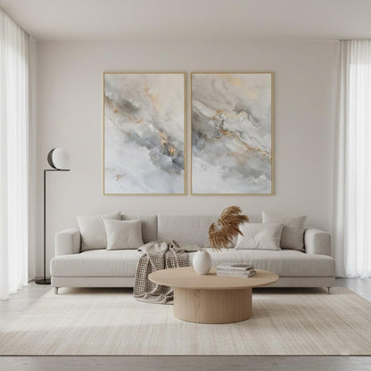 a modern living room with a gray sofa, a wooden coffee table, and two large abstract paintings on the wall above the sofa.