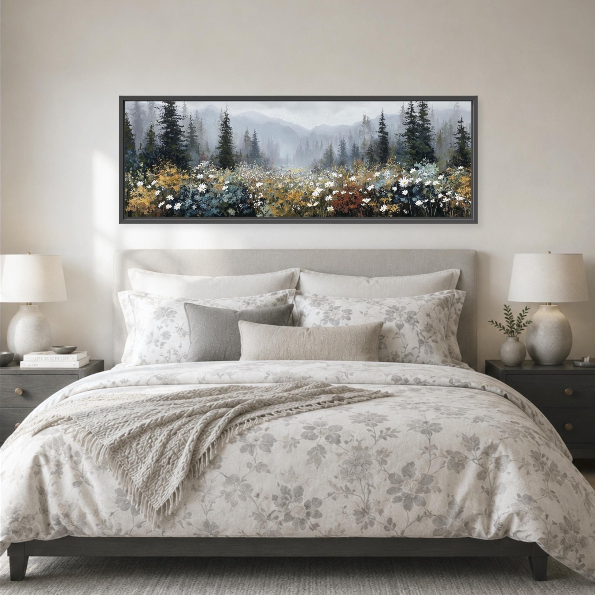 a large bedroom with a bed, nightstands, and a framed landscape painting hanging above the bed.
