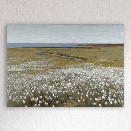 A large field of white flowers stretches out in the foreground, leading to a body of water in the distance.
