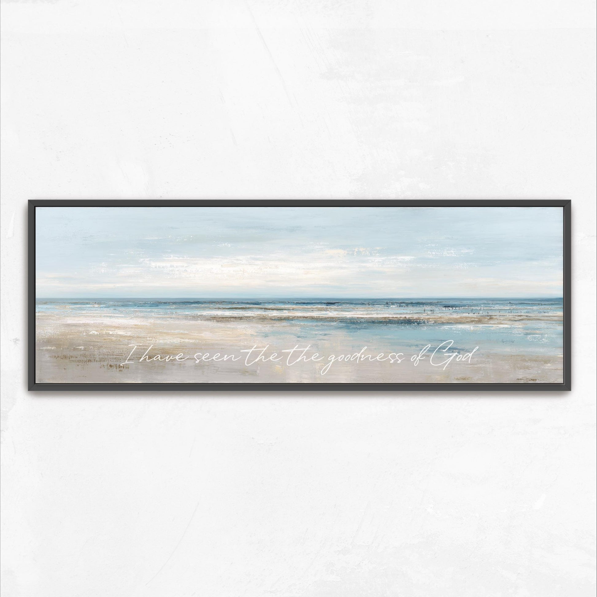 The image is a framed painting depicting a serene beach scene with a vast ocean and a cloudy sky.