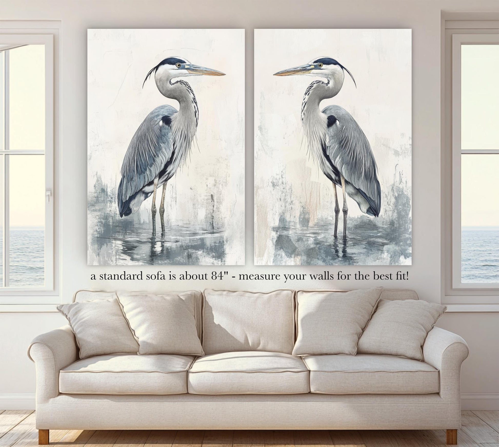 a living room with a couch and two paintings of birds