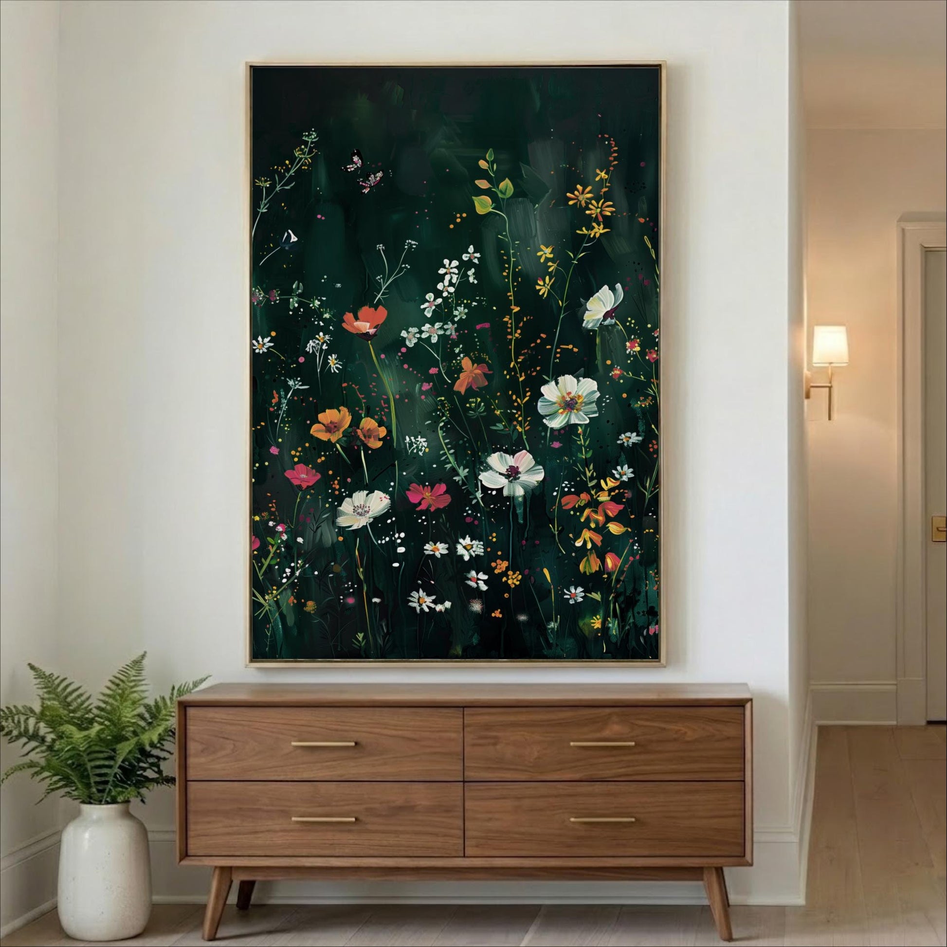 a large, vibrant painting of flowers hanging on a wall above a wooden dresser with four drawers.