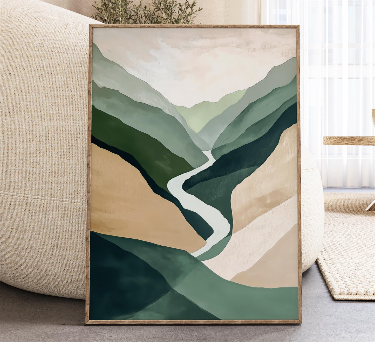 a framed abstract painting depicting a winding river flowing through a mountainous landscape.