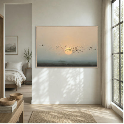 a serene bedroom scene with a large framed picture of a sunrise or sunset over a landscape, a bed, a nightstand, and a window.
