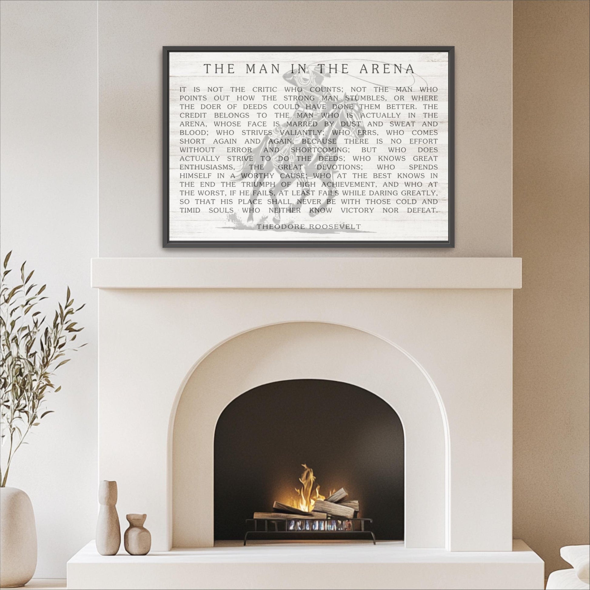 a framed text titled "THE MAN IN THE ARENA" displayed above a fireplace.