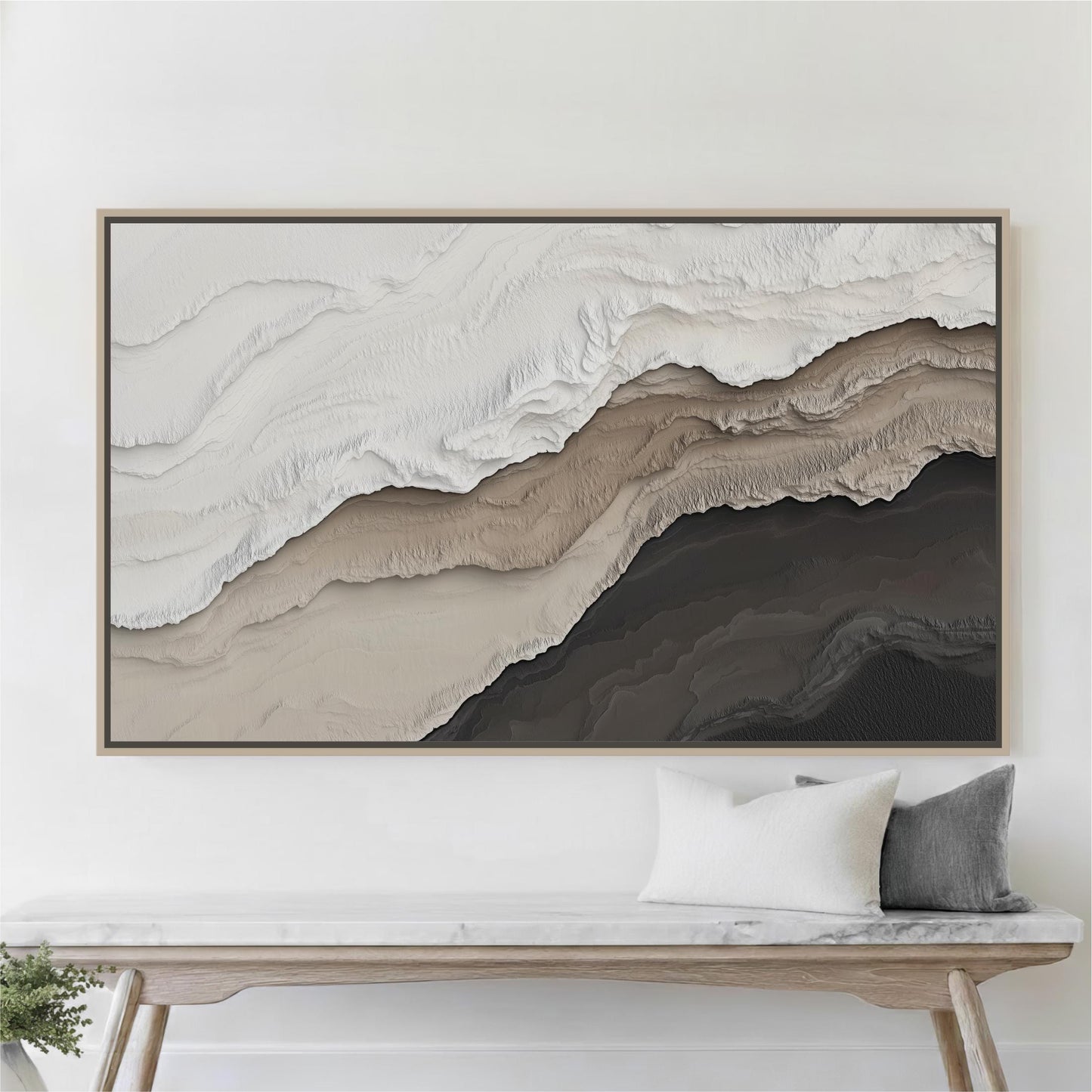 a large abstract painting hanging on a white wall above a wooden bench with two pillows.