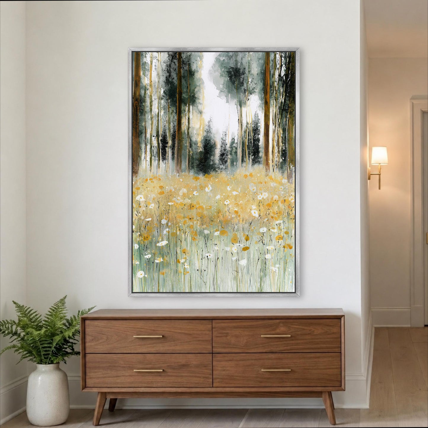 a large painting of a field of flowers hanging on a wall above a wooden dresser.