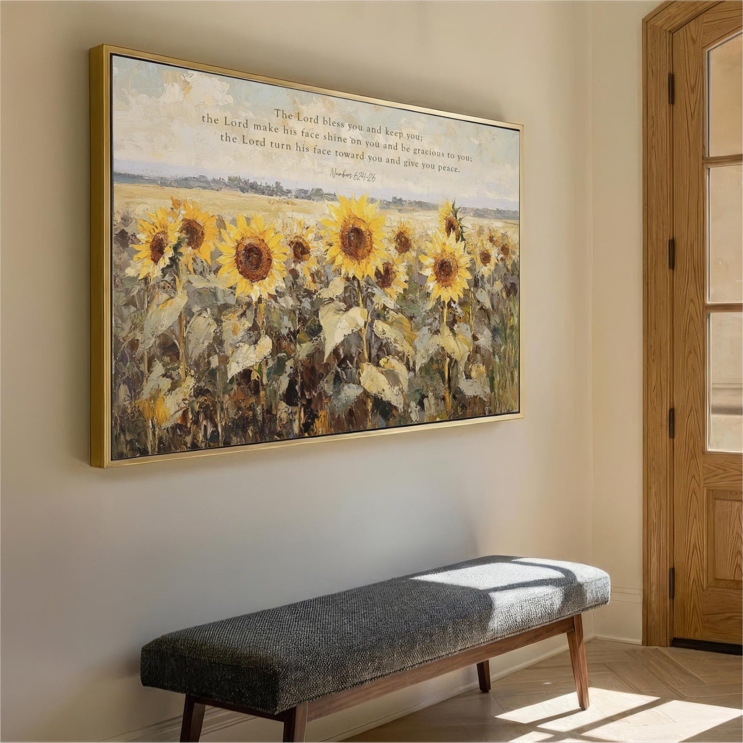 a large painting of a field of sunflowers hanging on a wall, with a bench in front of it.