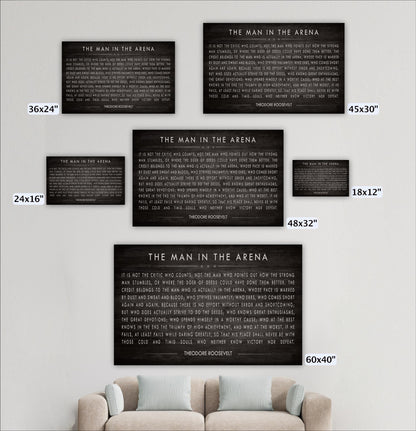 a collection of five black and white posters or wall art pieces, each with a different title or message, displayed on a wall above a couch.