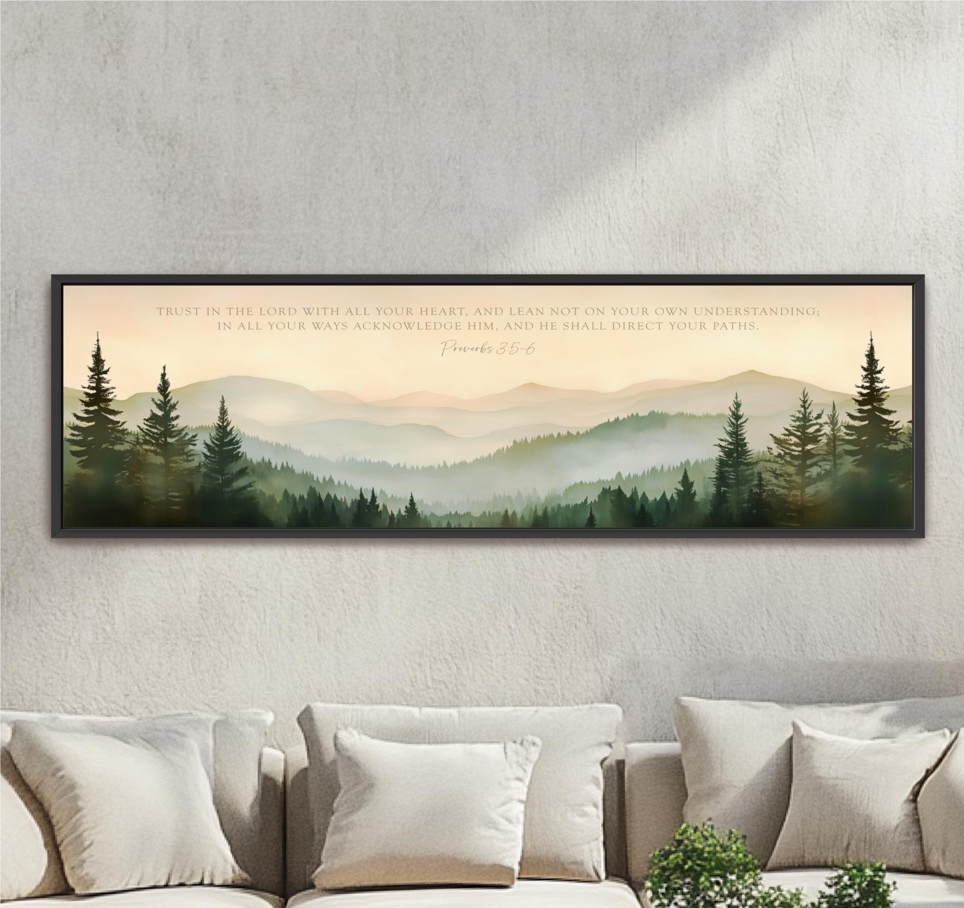 a large framed print of a serene mountain landscape with pine trees, set against a pale blue sky.