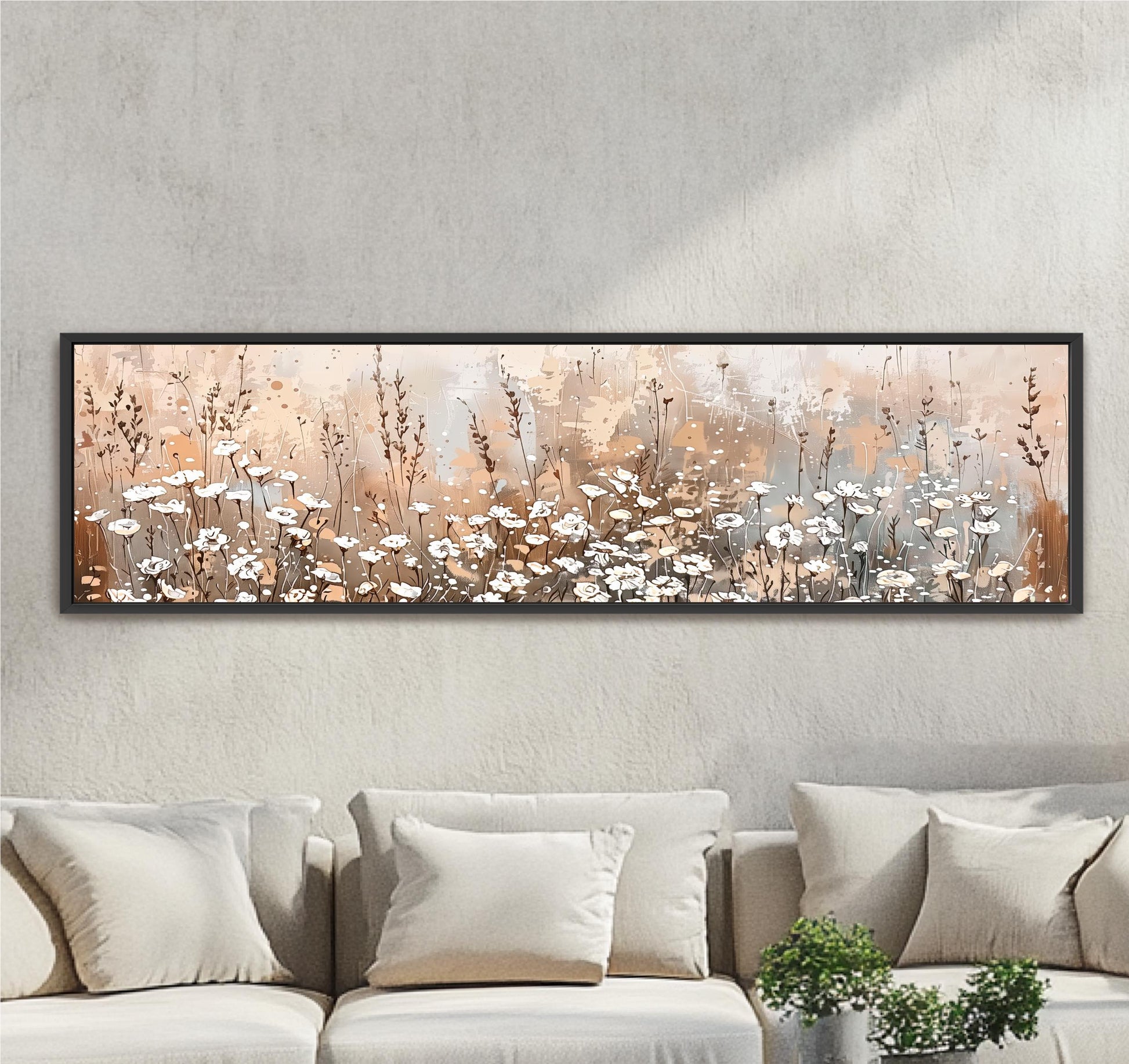 a large, rectangular painting of a field of flowers hanging on a wall above a couch.