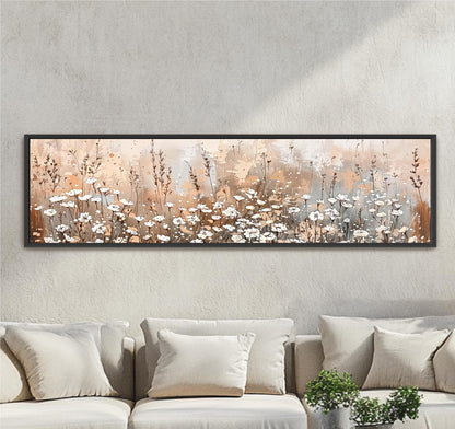 a large, rectangular painting of a field of flowers hanging on a wall above a couch.