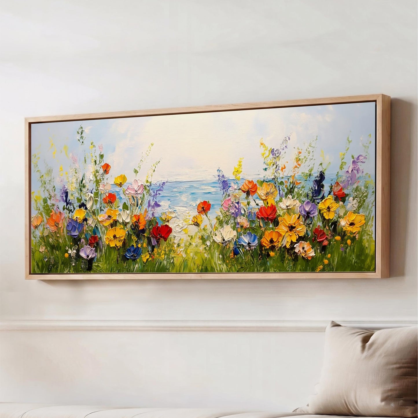 a large, vibrant painting of a field of colorful flowers, with a body of water in the background.