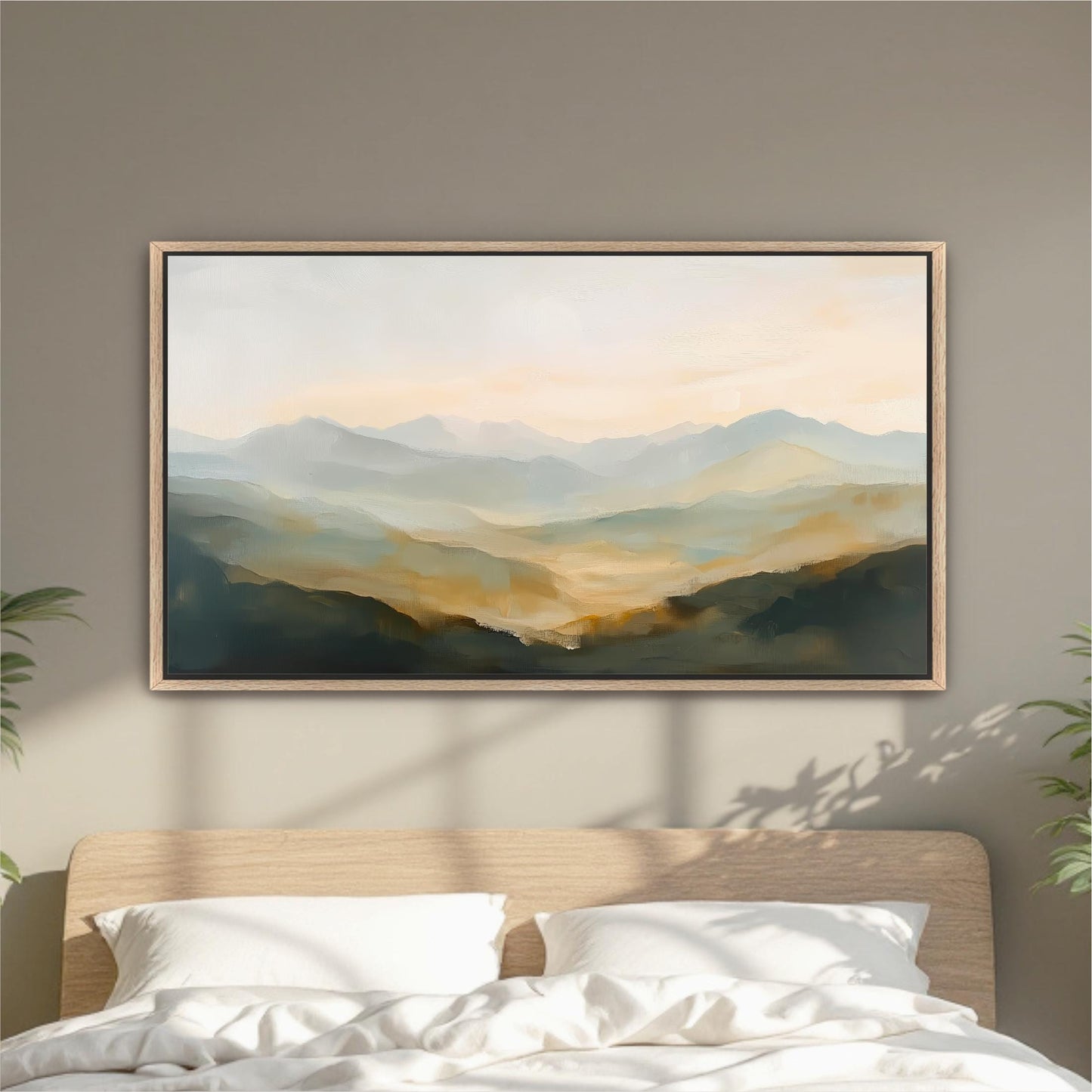 a large landscape painting hanging on a wall above a bed with white pillows.