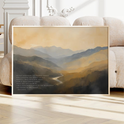 a framed landscape painting depicting a mountainous, forested scene with a winding river.