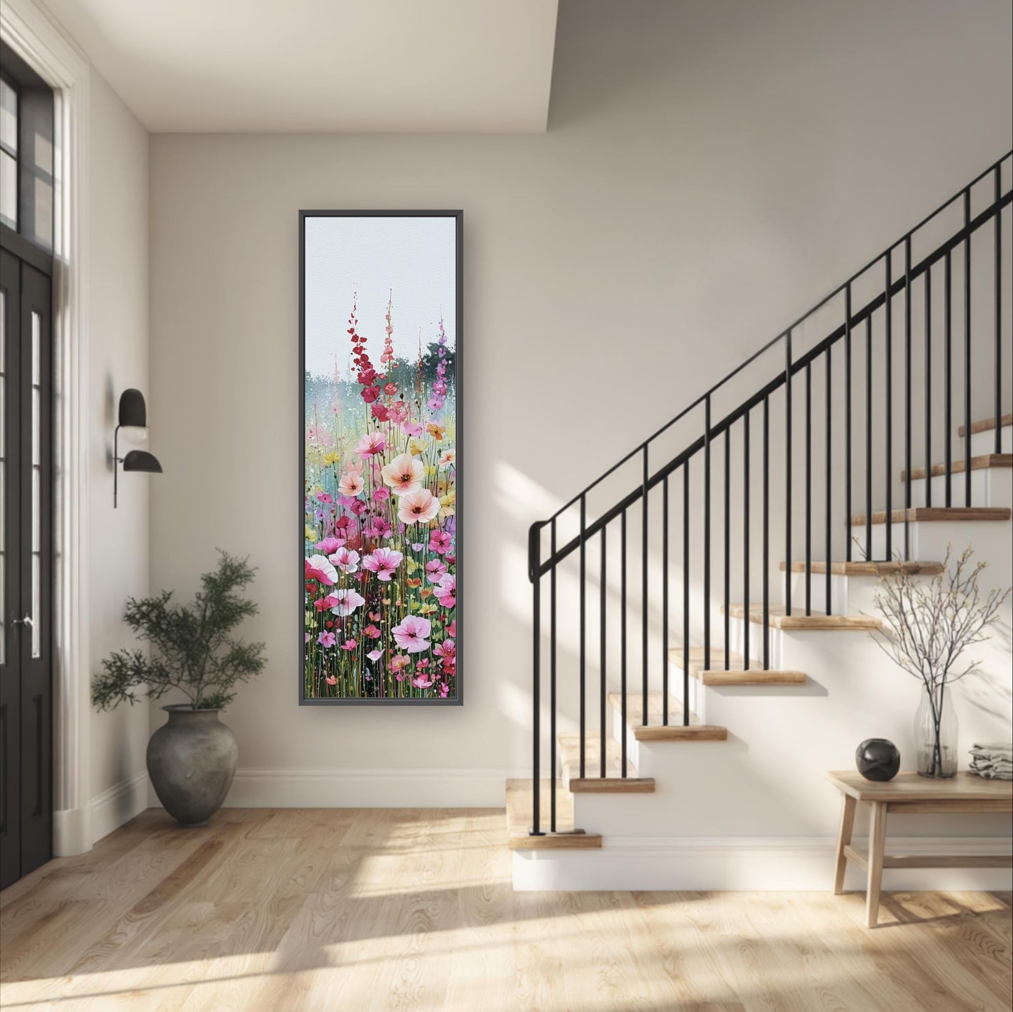 a modern and minimalist interior design, featuring a large framed painting of a colorful floral scene hanging on the wall above a wooden staircase. The painting adds a vibrant touch to the otherwise neutral-toned space.