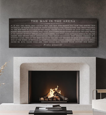 a fireplace with a plaque above it that reads the man in the arena