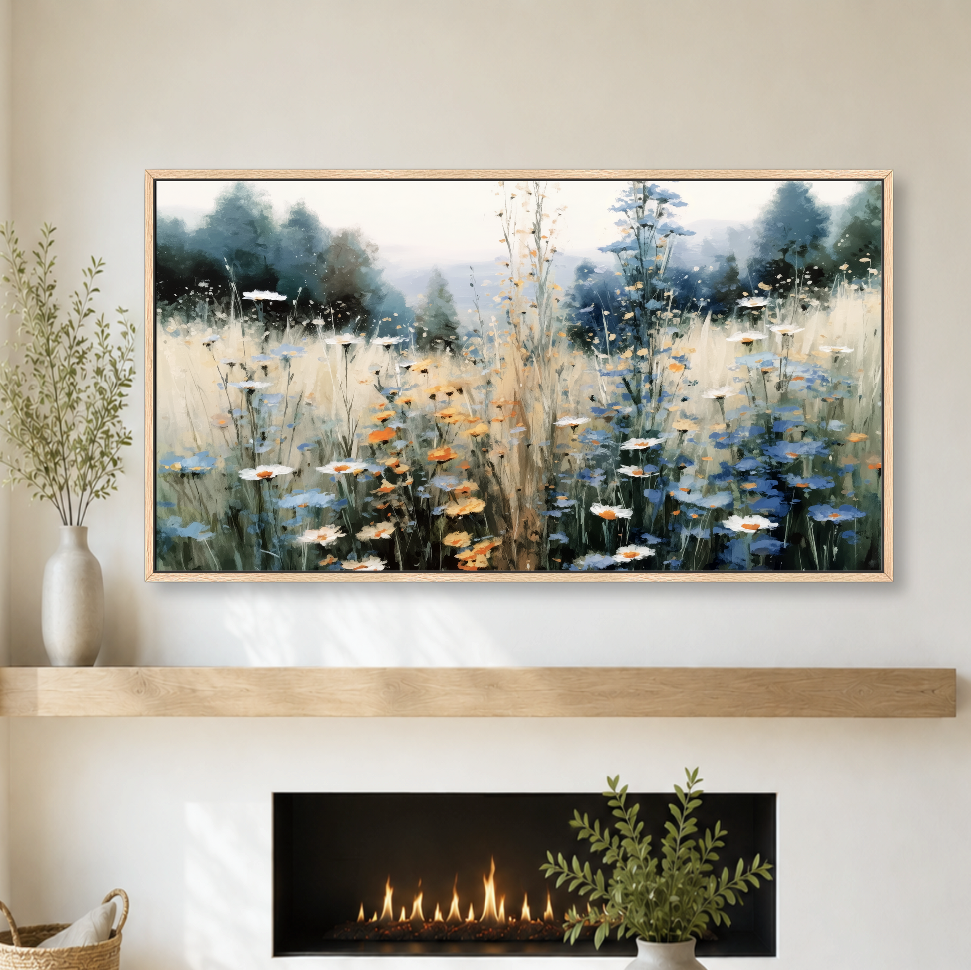 a large framed painting of a field of flowers hanging on a wall above a fireplace.