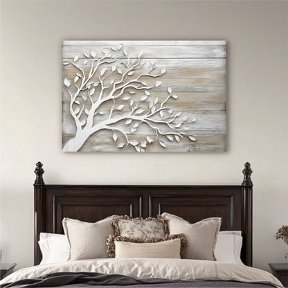 a large wooden headboard with a white tree branch design on it, hanging above a bed with white pillows and a gray comforter.