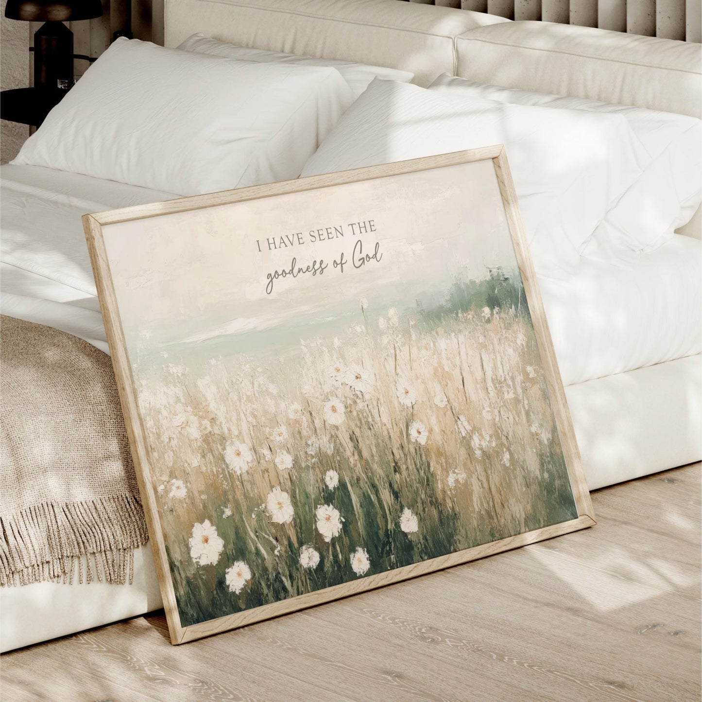 a picture of a bed with a picture of a field of flowers