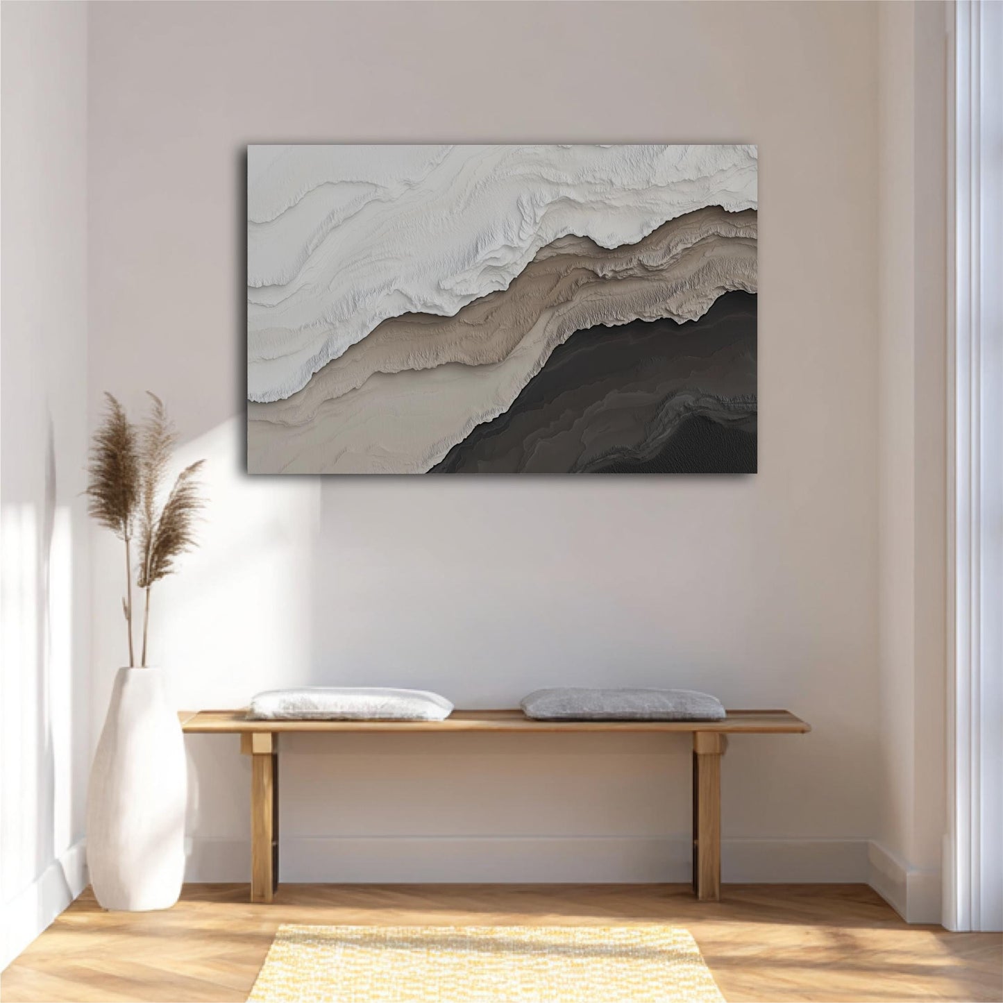 a minimalist interior design with a large abstract painting hanging on the wall above a wooden bench with two white cushions. The painting has a textured, layered appearance with shades of gray and brown. The room has a clean, white color scheme with a wooden floor and a yellow rug, creating a calm and serene atmosphere.
