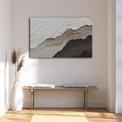a minimalist interior design with a large abstract painting hanging on the wall above a wooden bench with two white cushions. The painting has a textured, layered appearance with shades of gray and brown. The room has a clean, white color scheme with a wooden floor and a yellow rug, creating a calm and serene atmosphere.