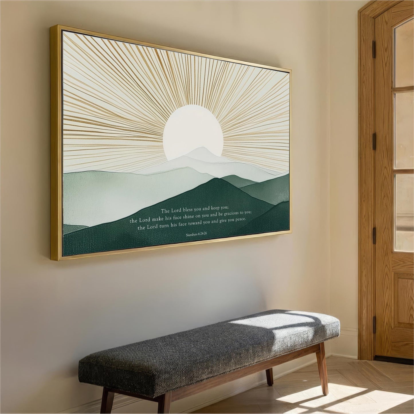 a large framed artwork depicting a serene landscape with a sun rising over a mountain range, hanging on a wall in a room with a wooden door and a bench.
