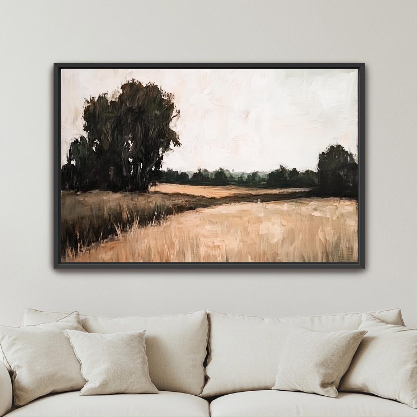 a large, framed painting of a rural landscape with a field and trees in the background.