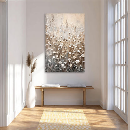 a serene and minimalist living space with a large painting of flowers hanging on the wall above a wooden bench. The painting is predominantly brown and white, with the flowers depicted in shades of white and brown. The room has a clean, white color scheme with a wooden floor and a yellow rug, creating a warm and inviting atmosphere.