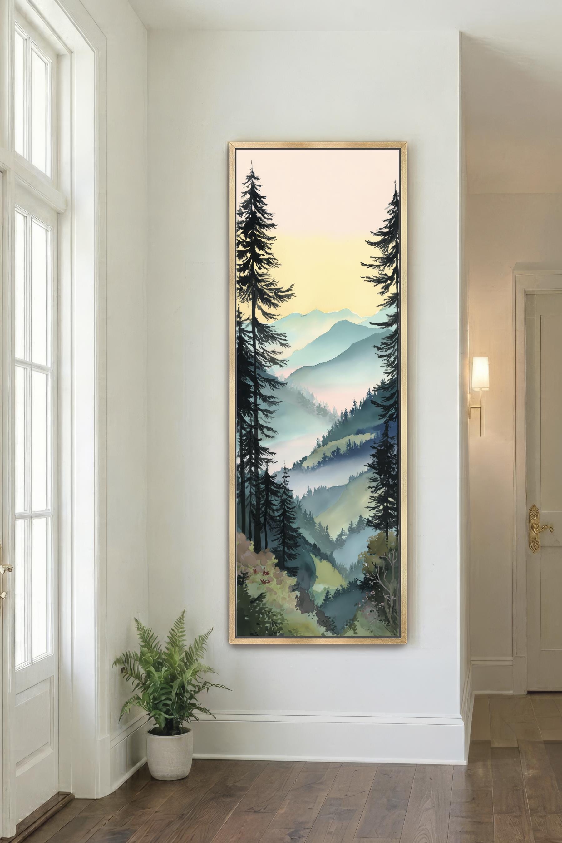 a large framed painting of a forest scene hanging on a white wall in a room with a wooden floor.