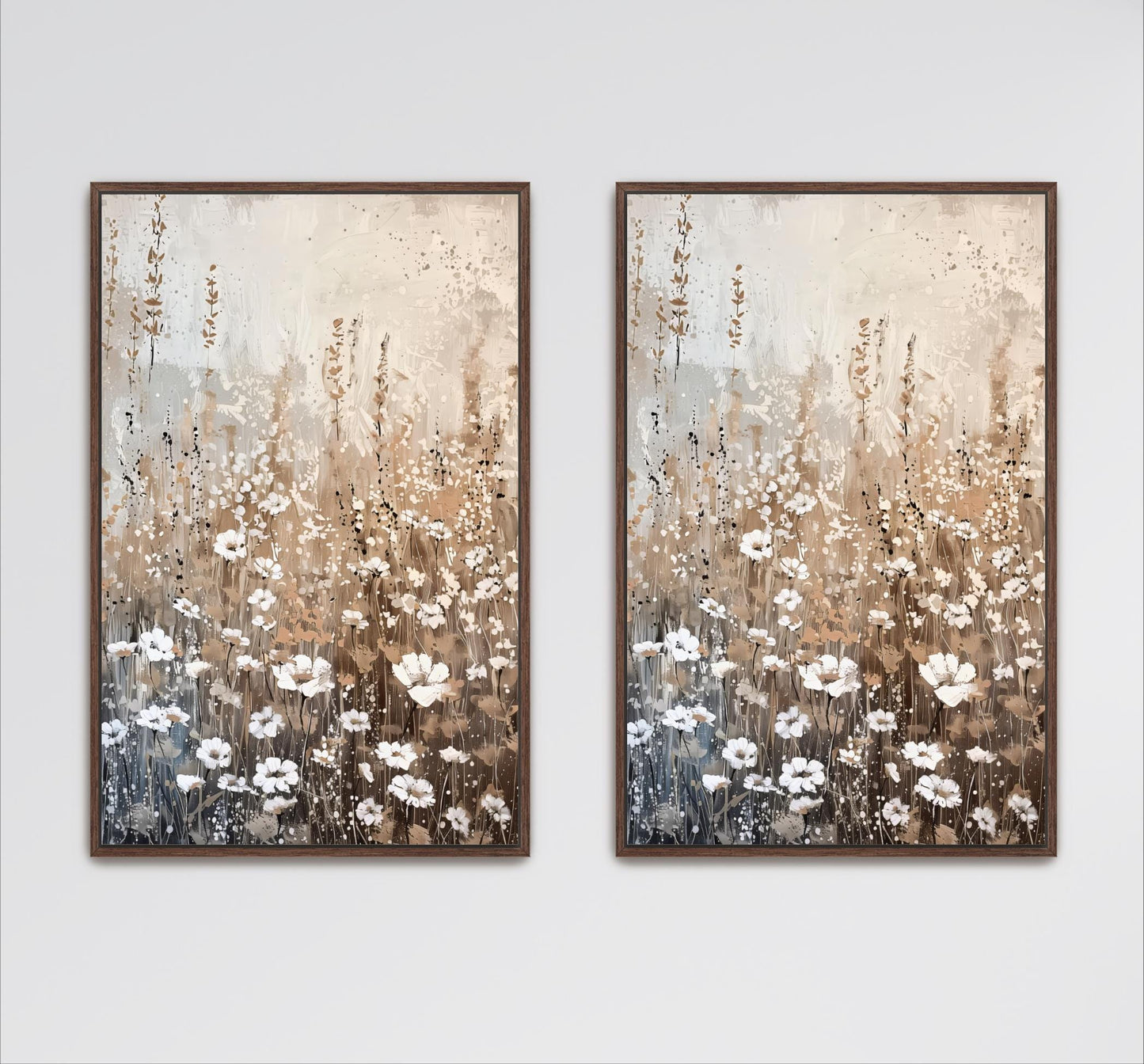 two framed paintings of a field of white flowers against a light brown background.