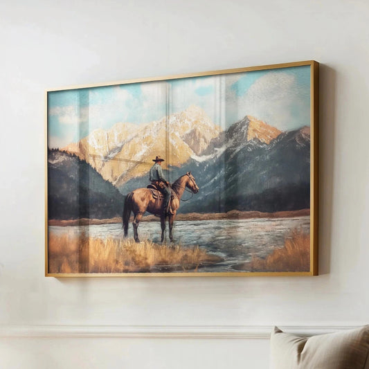 a cowboy riding a horse in a scenic landscape with mountains in the background.
