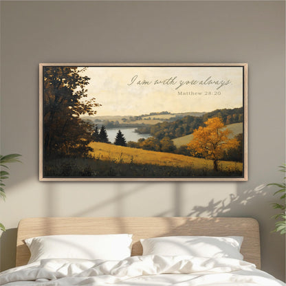 a framed painting of a serene landscape with a tree and a body of water, hanging on a wall above a bed with white pillows.