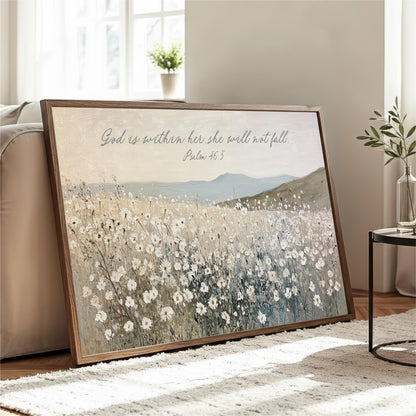 A framed painting depicting a field of white flowers is displayed on a wooden stand in a living room, with a potted plant and a vase nearby.