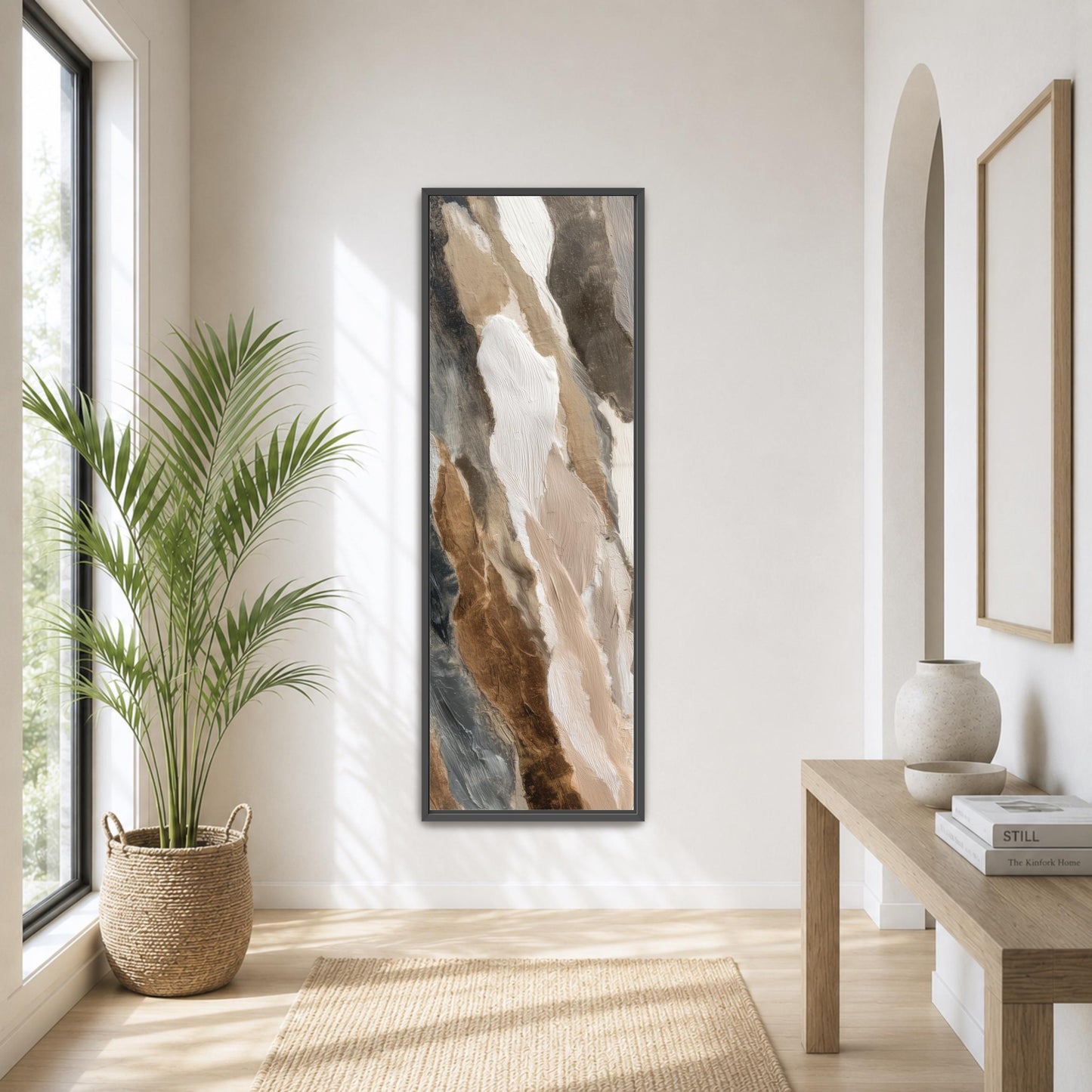 a serene and modern living room with a large abstract painting hanging on the wall, a potted plant, a wooden table, and a large window that allows natural light to fill the space.