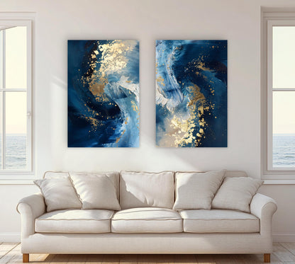 two large abstract paintings hanging on a white wall above a beige sofa in a living room.