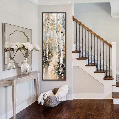 a well-decorated entryway with a wooden staircase, a mirror, a console table with a vase of white flowers, and a large painting of a forest scene hanging on the wall.