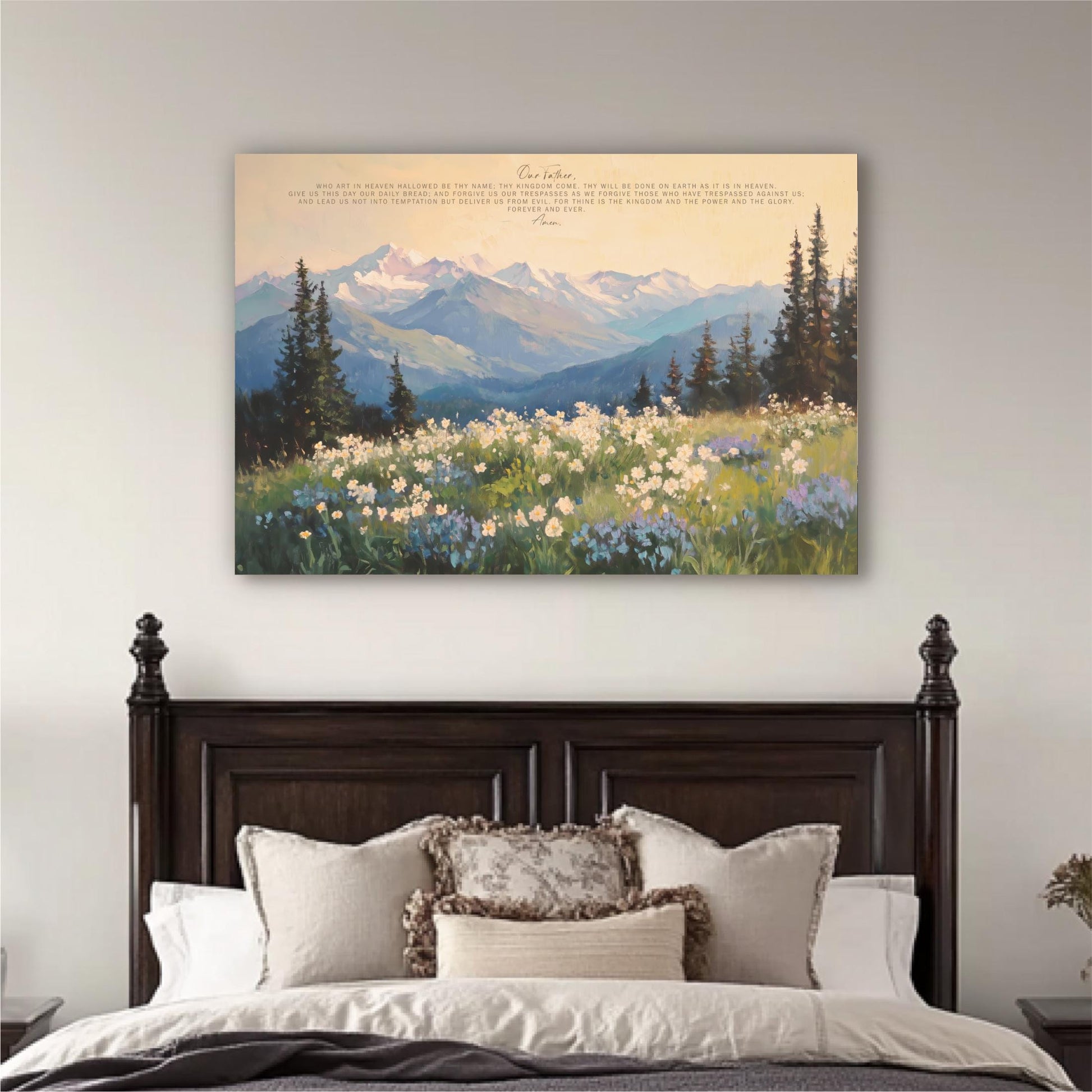a large painting of a mountain landscape with a field of flowers in the foreground, hanging above a bed with a wooden headboard.