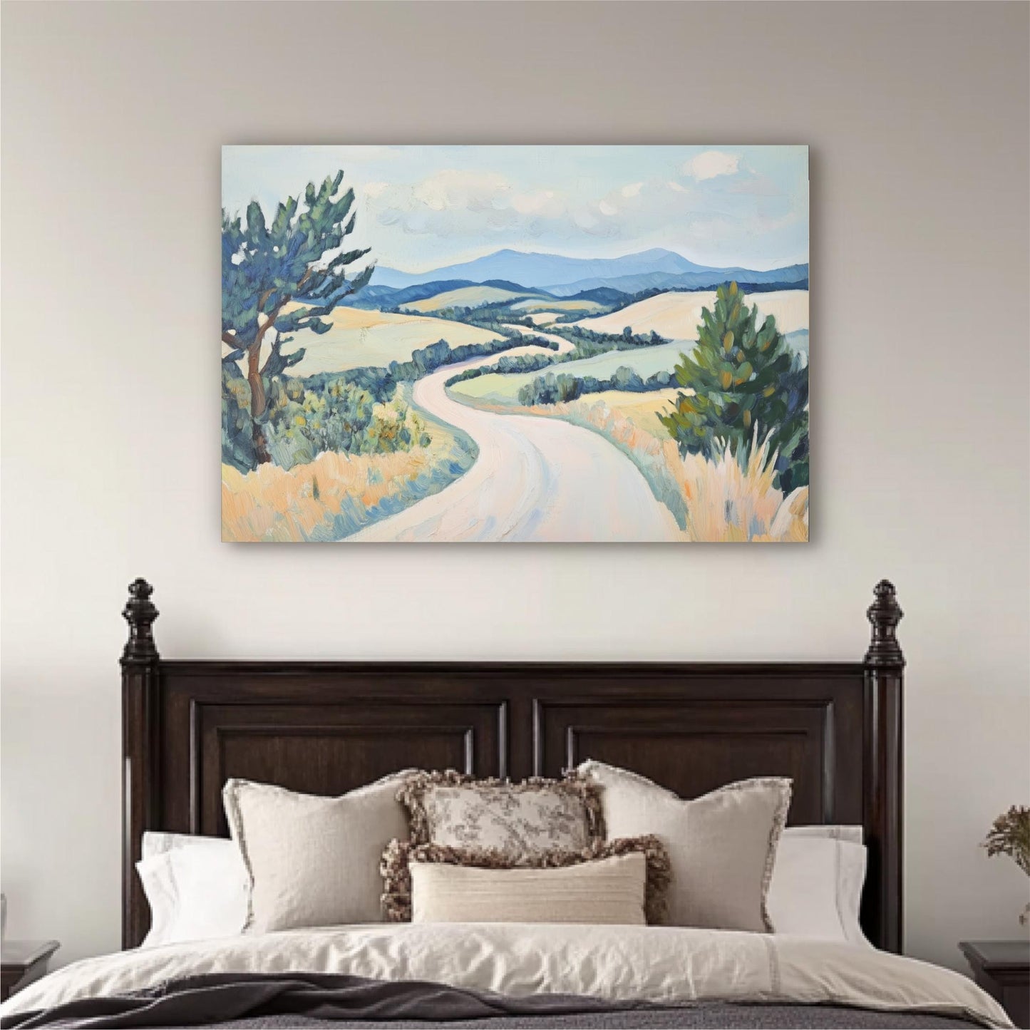 a large landscape painting hanging above a bed with a wooden headboard.