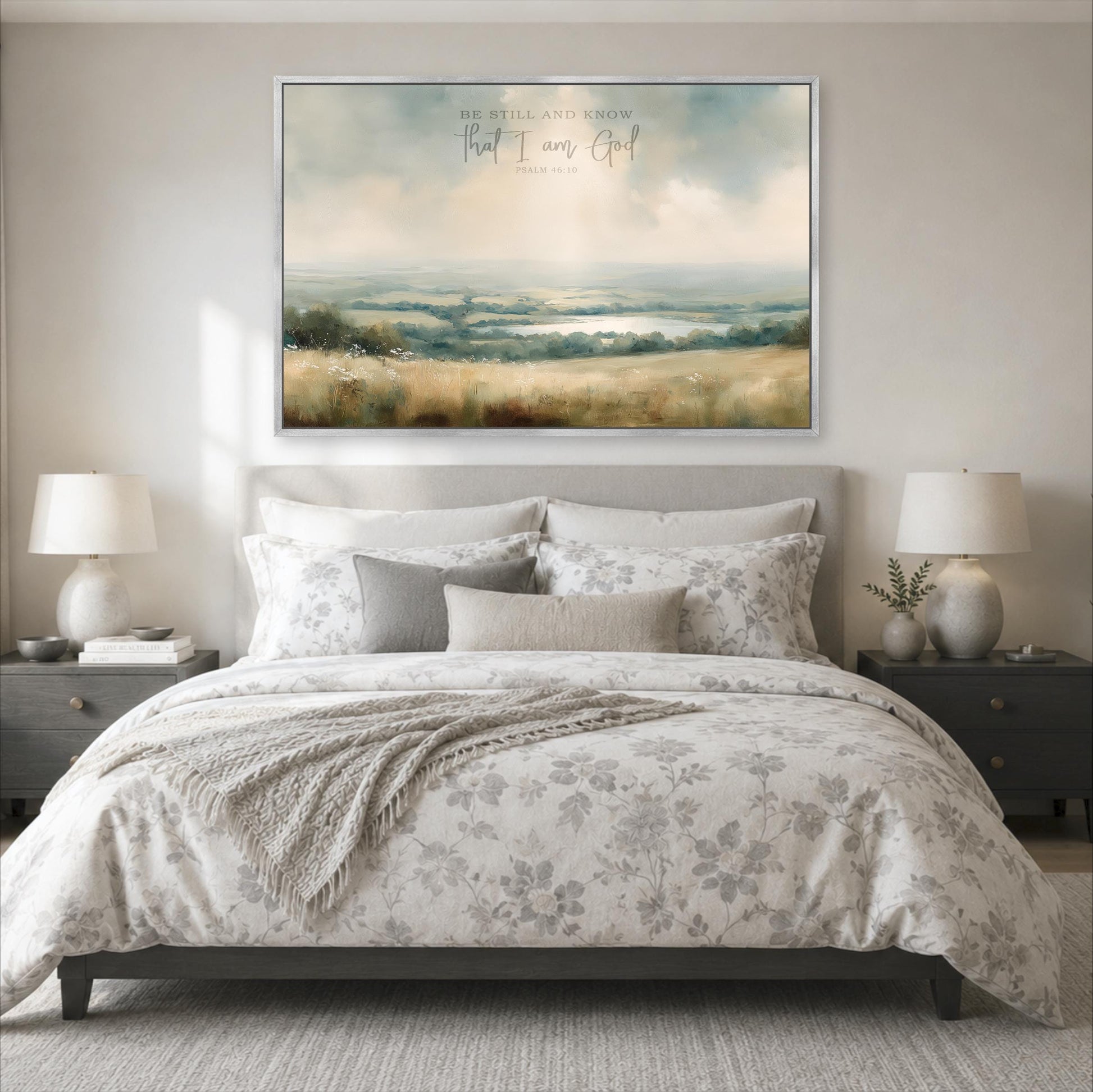 a large bedroom with a bed, nightstands, and a painting hanging above the bed. The painting depicts a serene landscape with a field and trees.