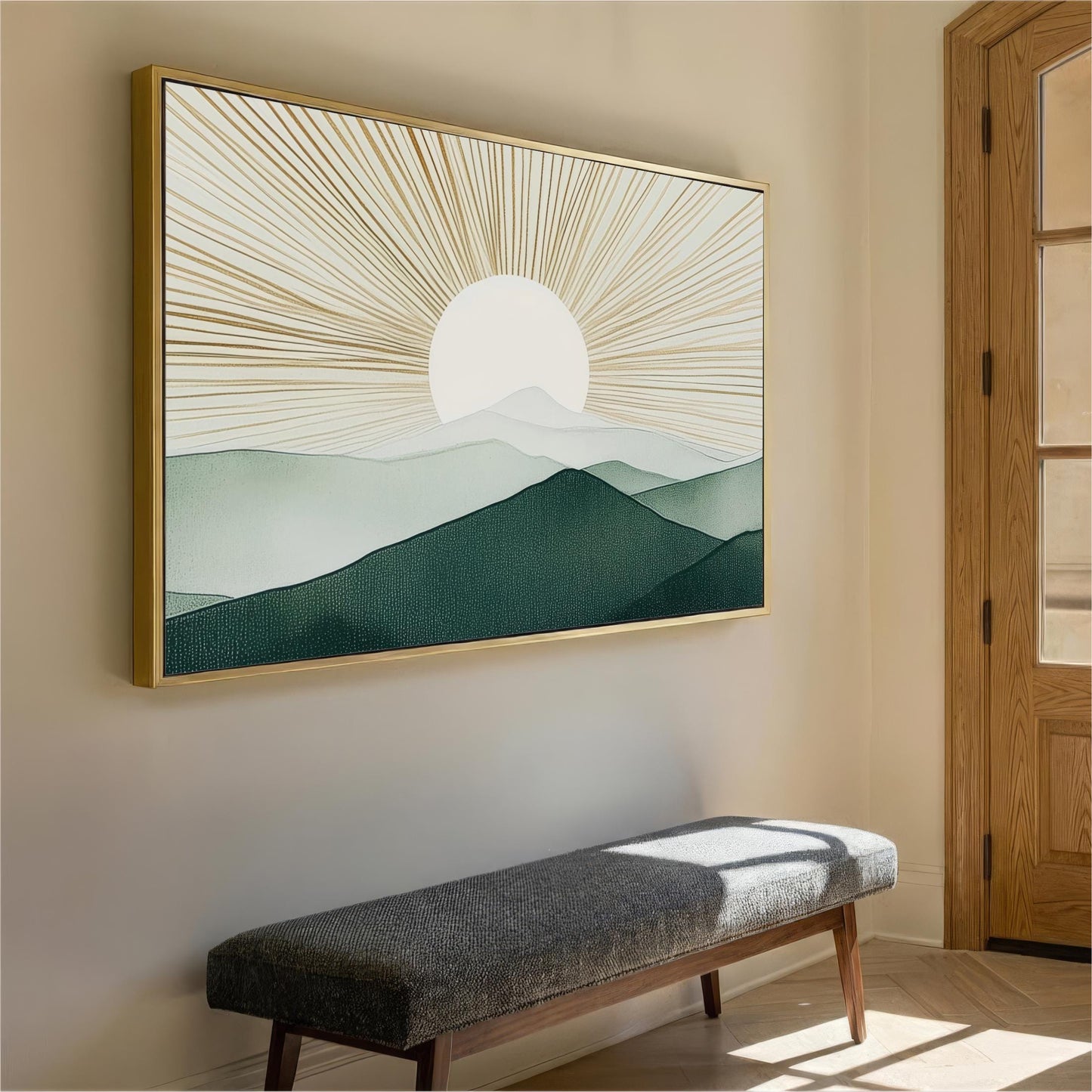 a large framed painting of a mountain landscape with a sun in the background, hanging on a wall above a gray bench.