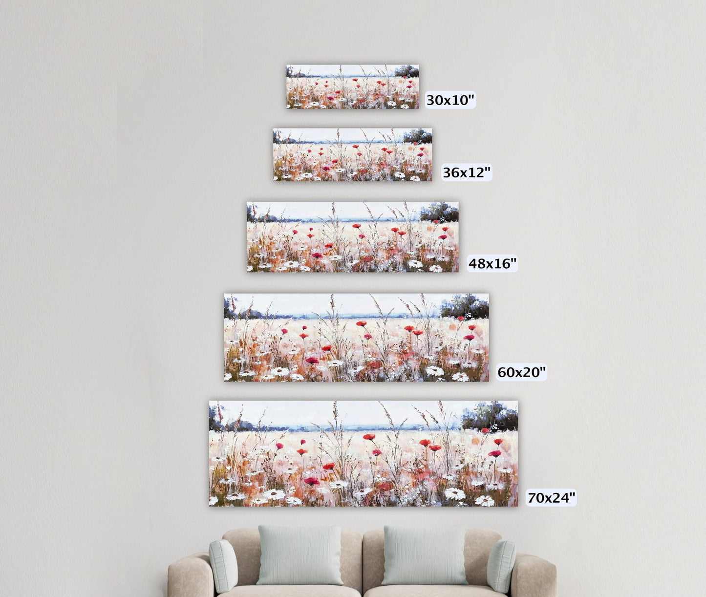 a living room with a couch and three pictures on the wall