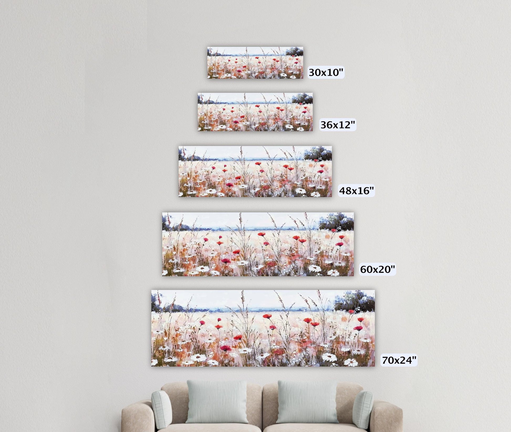 a living room with a couch and three pictures on the wall