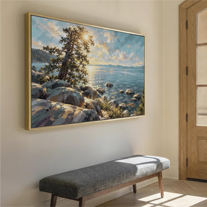a large painting of a rocky shoreline with a tree and a body of water, hanging on a wall above a gray bench.